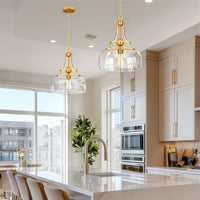 Kira Home Royale 17" Modern Pendant Light + Clear Glass Schoolhouse Shade, Adjustable Hanging Height, Cool Brass Finish