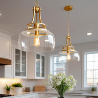 Video: Kira Home Royale 17" Modern Pendant Light + Clear Glass Schoolhouse Shade, Adjustable Hanging Height, Cool Brass Finish
